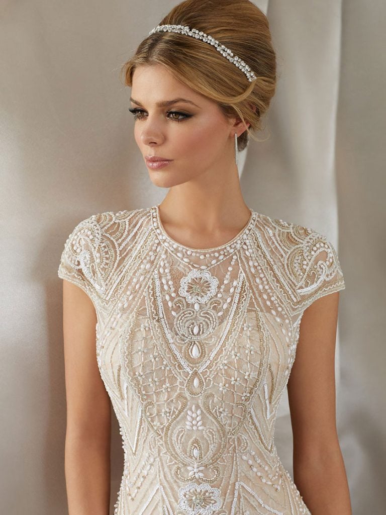 Lace sheath wedding gown Bridal & Tuxedo Galleria showroom