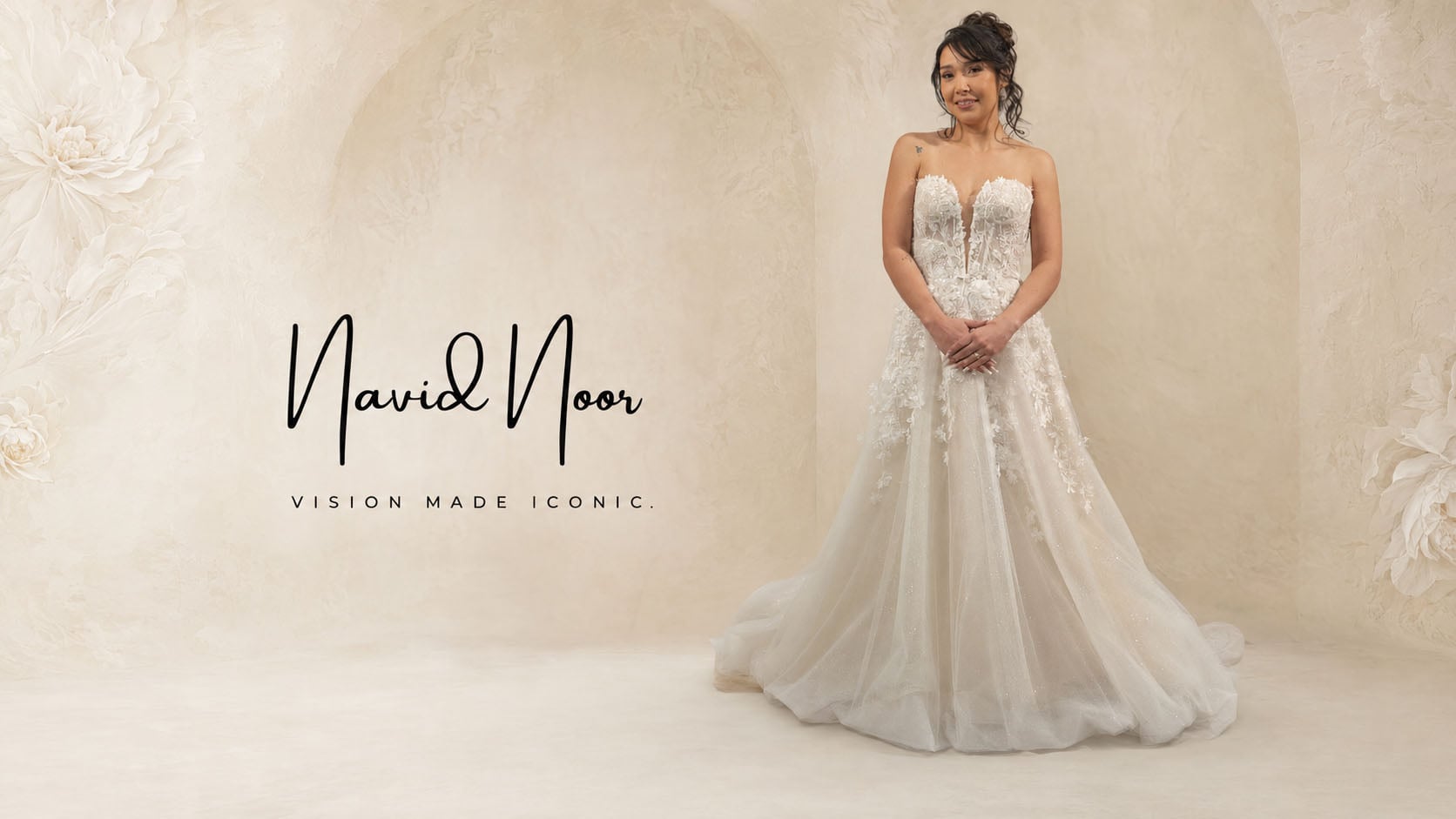 Navid Noor couture collection floral applique wedding dress with a plunging bodice, featured by Bridal and Tuxedo Galleria San Diego.