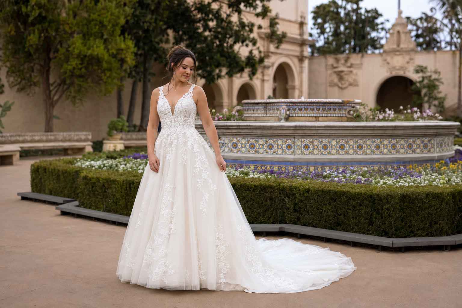 Bride wearing a romantic A-line Best wedding dress styles for Balboa Park’s Alcazar Garden in San Diego
