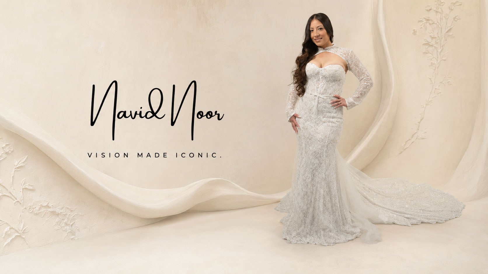 Bride wearing a fitted floral applique wedding dress from the Navid Noor couture collection at Bridal and Tuxedo Galleria San Diego.