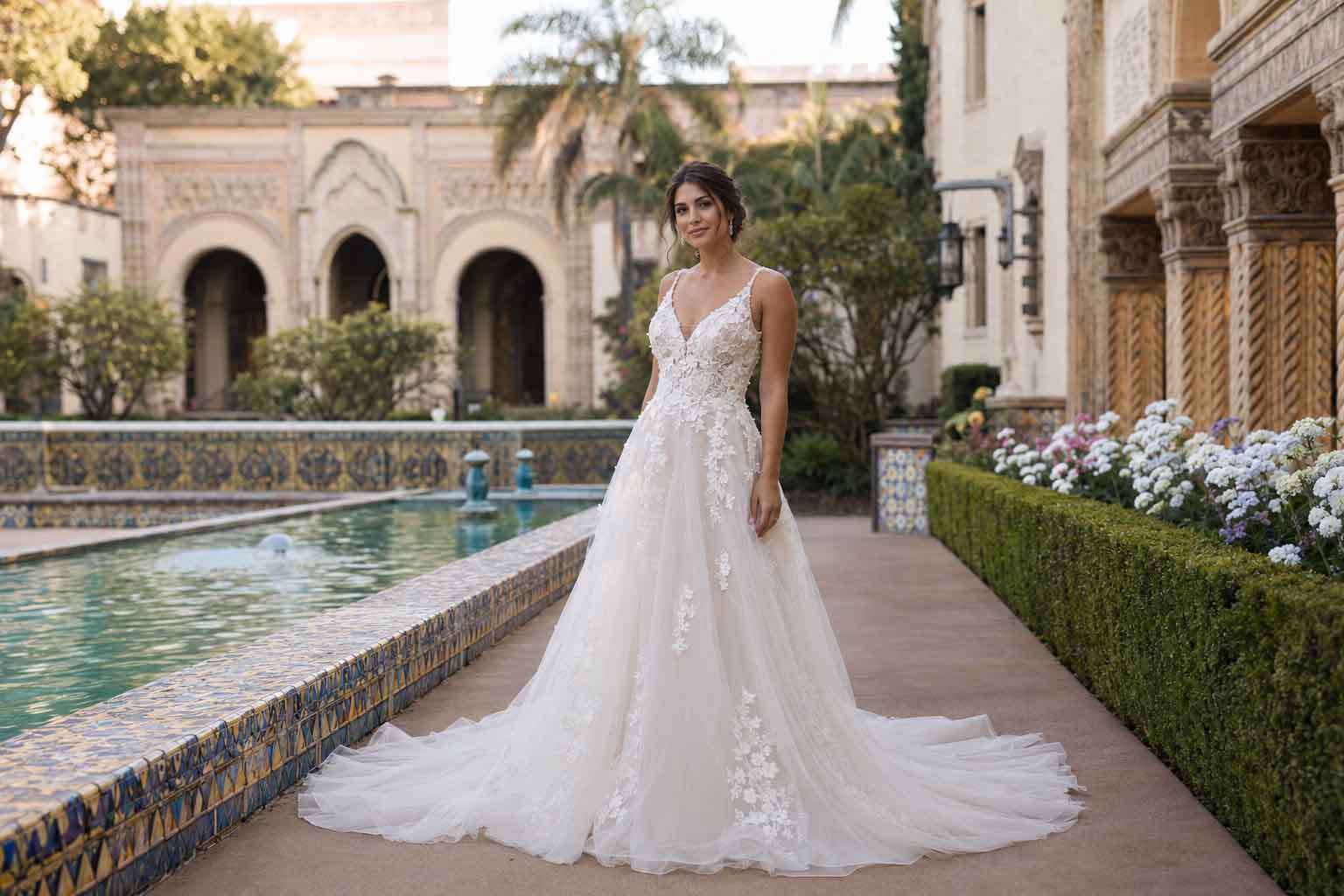 Bride wearing an architectural ball gown inside a historic Balboa Park ballroom