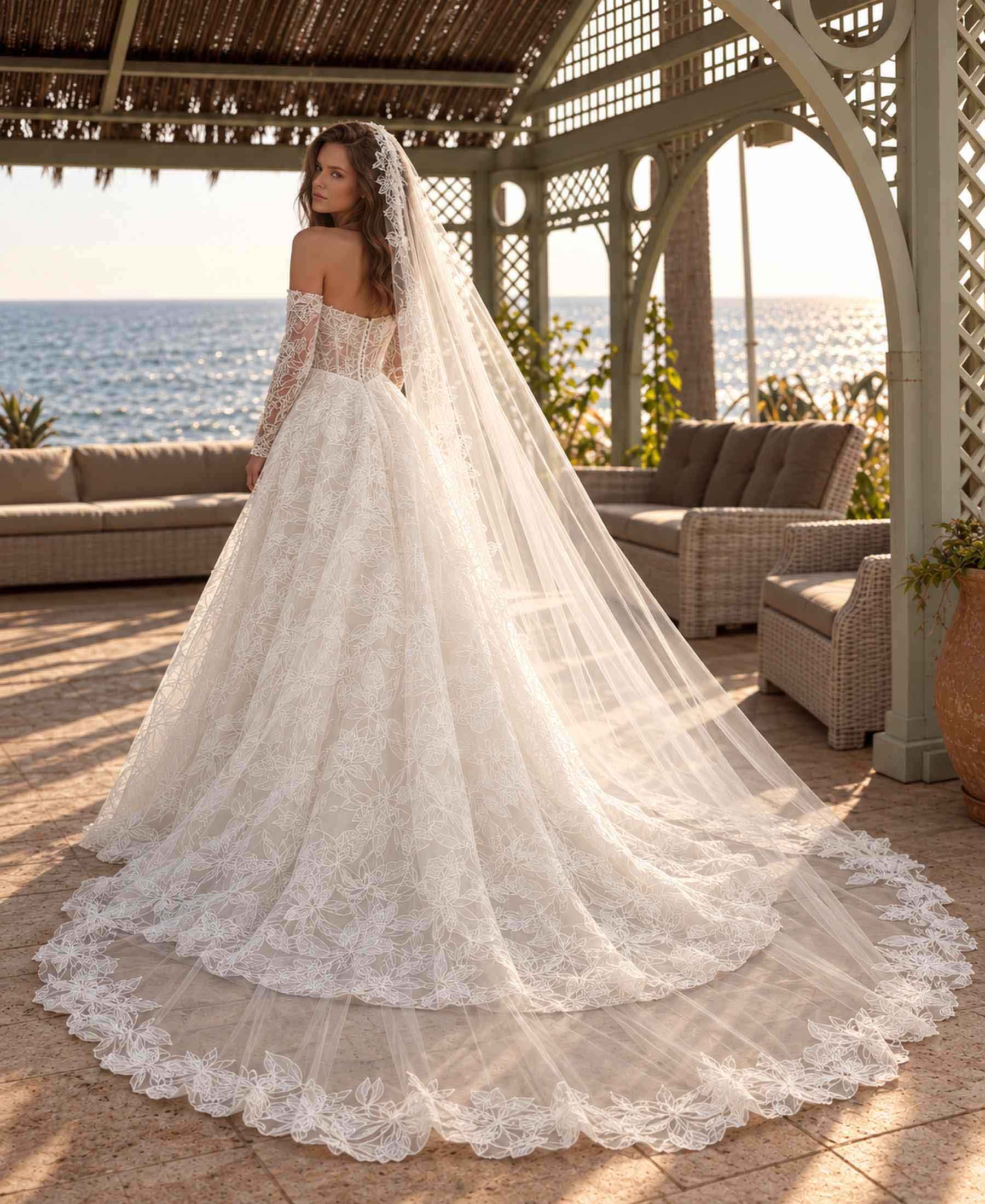 Back view of Mercedes wedding dress with floral lace train and long veil